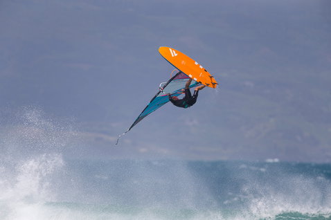 Fanatic FreeWave TE windsurf board during wave riding aerial over the ocean