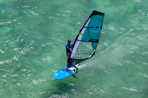 Fanatic Gecko Foil LTD windsurf foil board 135L in cyan during windsurfing on the ocean
