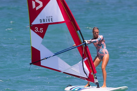 Fanatic Viper windsurf board during windsurfing on turquoise ocean water on a sunny day