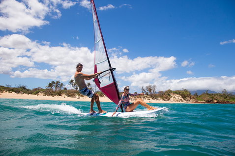 Fanatic Viper windsurf board during windsurfing in a tropical lagoon with two riders
