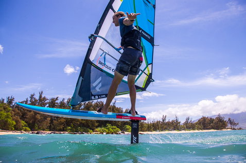 Fanatic Stingray LTD foil windsurf board 125L in cyan during foiling on the ocean