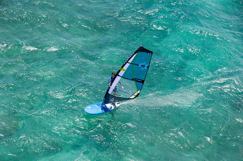 Fanatic Gecko Foil LTD windsurf board 135L during windsurfing on turquoise ocean
