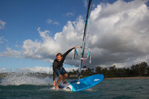 Fanatic Gecko Foil LTD windsurf board 135L in ocean blue during windsurfing in tropical waters