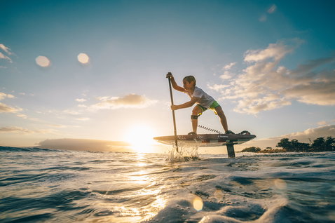 Fanatic Sky SUP foil board during SUP foiling on the ocean at golden-hour sunset