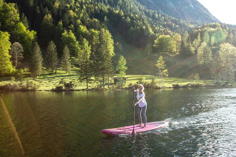 Duotone Diamond Air Touring inflatable SUP board 11'6" during stand up paddling on an alpine lake