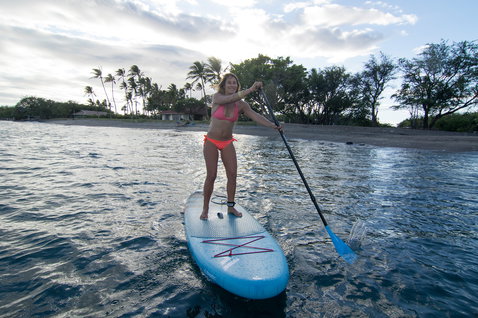 Duotone Fly Air inflatable SUP board during stand up paddling in a tropical bay