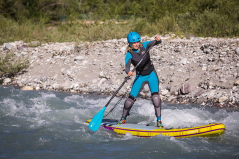 Fanatic Rapid Air Touring inflatable SUP board during whitewater paddling on a river