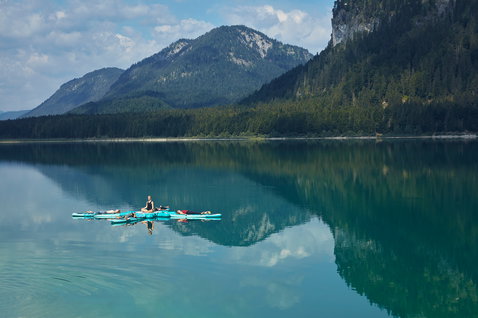 Duotone Fly Air Fit inflatable SUP fitness platform 10'0" during SUP yoga on an alpine lake