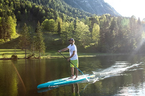Duotone Ray LTD SUP touring board 12'6" during stand-up paddling on an alpine lake