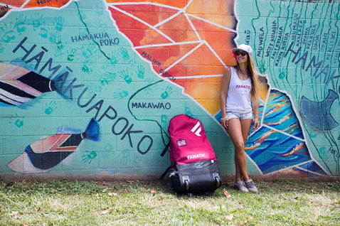 Fanatic Diamond Air SUP backpack in pink and black during outdoor paddleboard adventure in Hawaii