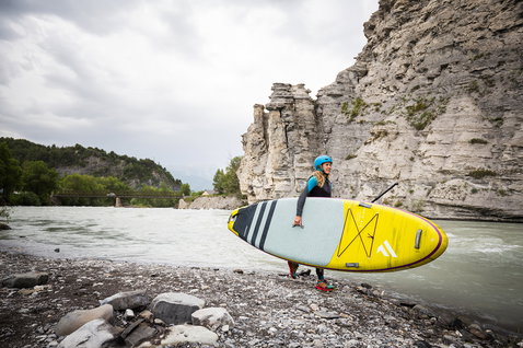 Fanatic Rapid Air Touring inflatable SUP board 11ft in yellow-green during river touring at canyon