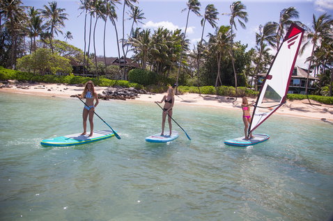 Fanatic Ride SUP windsurf rig on Viper Air board during freeride sailing in a tropical beach lagoon