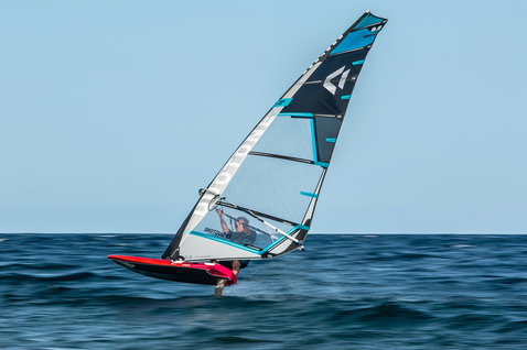 Fanatic Falcon Foil TE windsurf foil board during foiling on the open ocean in red and black
