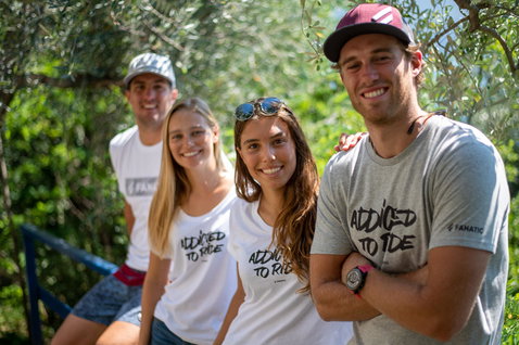 Fanatic Addicted to Ride Tee SS men's short sleeve t-shirt in white and light grey worn by group outdoors
