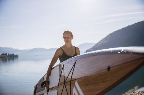 Fanatic Ray Bamboo Edition touring SUP board 12'6" during stand-up paddling at an alpine lake