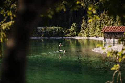 Fanatic Ray Bamboo Edition touring SUP board 12'6" during paddling on a calm alpine lake