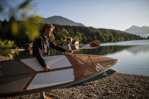 Fanatic Ray Bamboo Edition SUP touring board 12'6" during stand up paddling at an alpine lake
