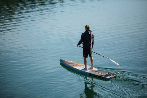Fanatic Ray Bamboo Edition SUP touring board 12'6" during stand-up paddling on calm water