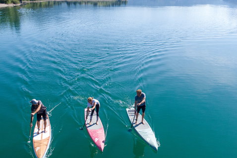 Fanatic Ray Bamboo Edition SUP touring board 12'6" during stand-up paddling on a mountain lake