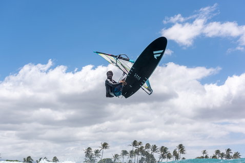 Fanatic FreeWave TeXtreme windsurf board during wave windsurfing aerial manoeuvre over the ocean