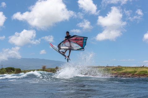 Fanatic FreeWave TeXtreme wave windsurf board during aerial wave riding on the ocean