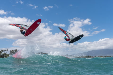 Fanatic FreeWave TE windsurf board during wave riding on the ocean with two riders performing aerials