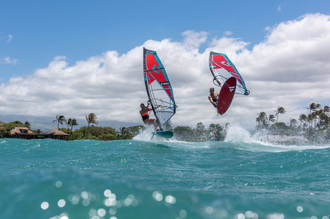 Fanatic FreeWave TE windsurf board during wave riding in a tropical ocean with two riders