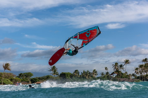 Fanatic FreeWave TE wave windsurf board during aerial wave riding maneuver in tropical ocean