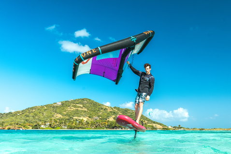 Fanatic Sky Air Premium inflatable foil board during wing foiling in a tropical lagoon