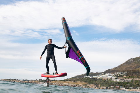 Fanatic Sky Air Premium inflatable foil board during wing foiling in a coastal bay