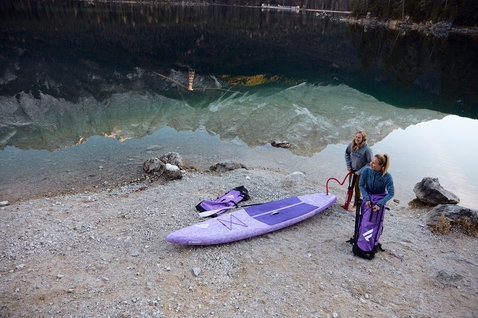 Duotone SUP Diamond Air Touring Pocket inflatable touring board 11'6" in lavender at an alpine lake