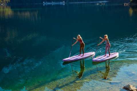 Duotone Diamond Air Touring Pocket inflatable SUP board 11'6" during stand-up paddling on a mountain lake