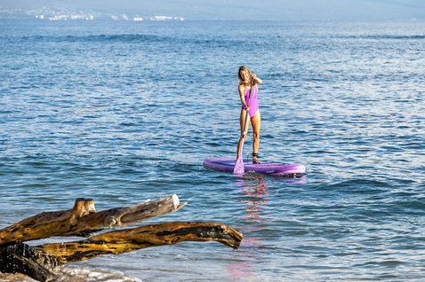 Fanatic Diamond Air Pocket inflatable SUP board 10'4" during stand-up paddling on calm water in violet