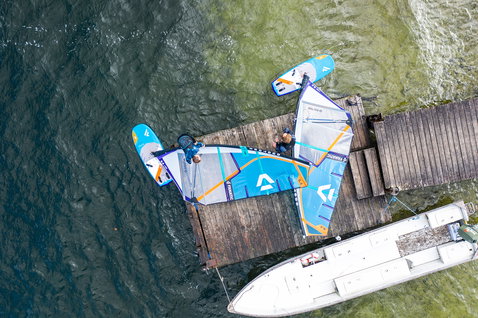 Fanatic Stingray LTD foil board during wing foiling and wind foiling at a waterfront dock