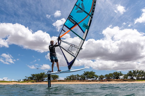 Fanatic Stingray HRS windsurf foil board during wind foiling at a sandy coastal beach
