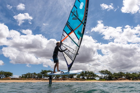Fanatic Stingray HRS windsurf foil board during wind foiling at a tropical beach