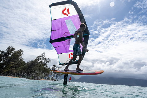 Fanatic Aero foil wing 1500 during wing foiling on the ocean in purple and grey