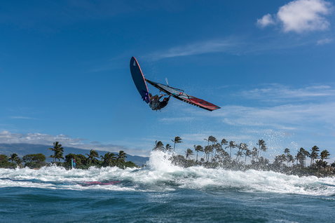 Fanatic Grip TE wave windsurf board during aerial wave maneuver on the ocean