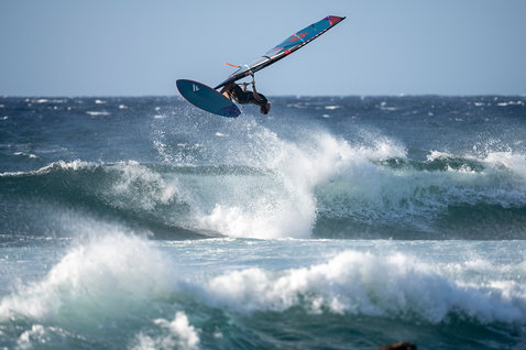 Fanatic Grip TE wave windsurf board during wave riding on the ocean in steel blue