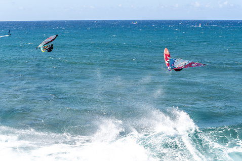 Fanatic Grip TE wave windsurf board during wave riding with aerial maneuver on the open ocean