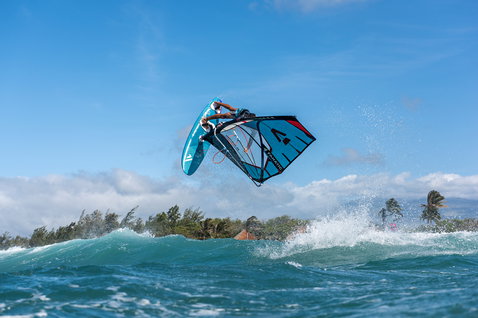 Fanatic FreeWave TE wave windsurf board during aerial windsurfing over ocean waves