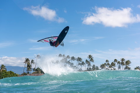 Fanatic FreeWave TeXtreme wave windsurf board during aerial wave riding in tropical ocean