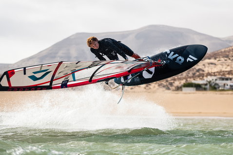 Fanatic Skate TE freestyle windsurf board during aerial freestyle trick on the ocean