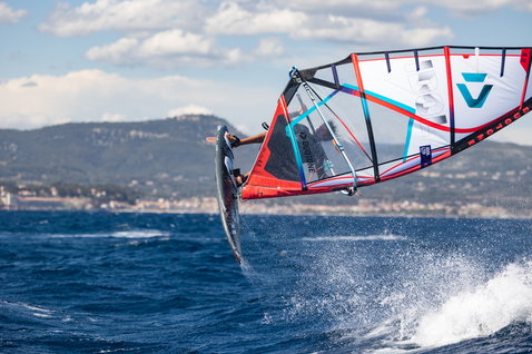 Fanatic Skate TE freestyle windsurf board during aerial freestyle trick on the ocean