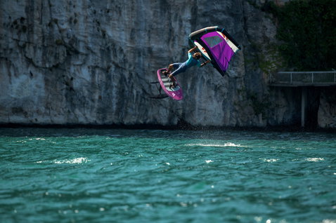 Fanatic Sky Wing foil board during wing foiling at Lake Garda with purple wing airborne