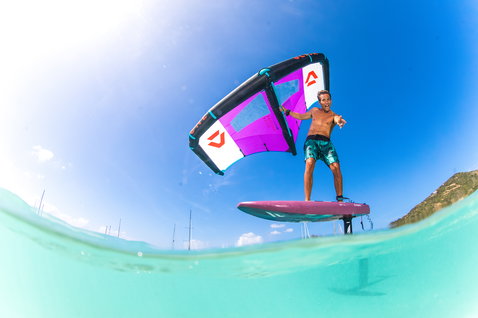 Fanatic Sky Wing foil board during wing foiling in a tropical lagoon with Duotone Slick wing