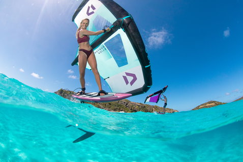 Fanatic Sky Wing foil board during wing foiling in tropical waters with Duotone Slick wing in cyan and navy