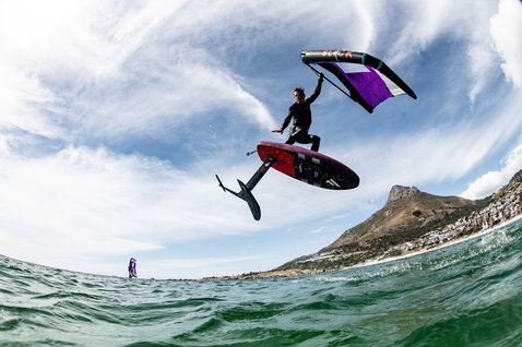 Fanatic Sky Wing foil board during wing foiling over the ocean with Cape Town mountain backdrop