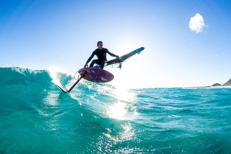 Fanatic Sky Wing foil board during wing foiling on turquoise ocean with Duotone Slick wing