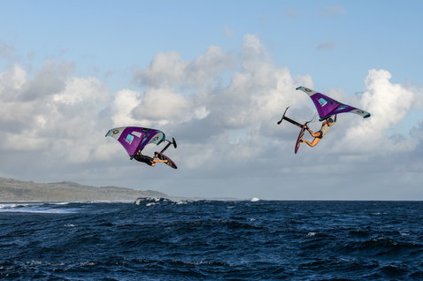 Fanatic X Duotone Carbon TE Mast & Fuselage Set during wing foiling over the ocean with two riders airborne